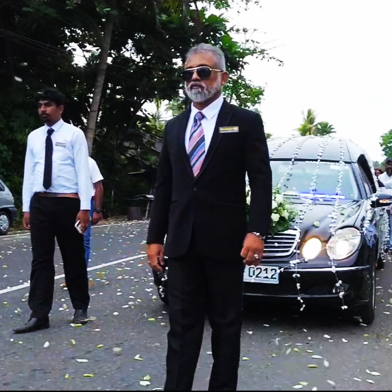 A hearse arriving at a funeral parlor